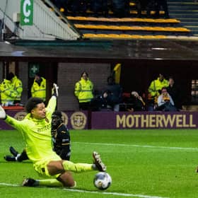 Motherwell's Blair Spittal (R) scores to make it 1-0 against Livingston.
