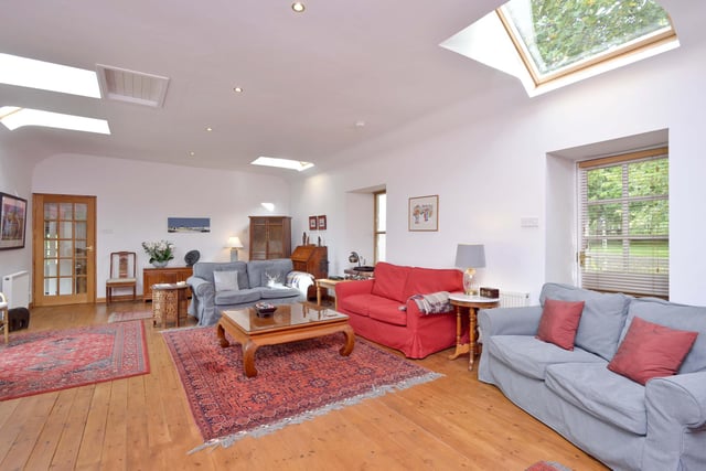 Interior: A spacious lounge features bi-folding doors and rooflights. The open-plan kitchen, dining and family room forms the heart of the home and features exposed beams and a stone wall. There is external and internal access to the annexe.