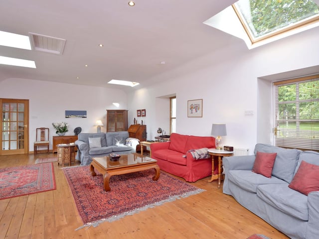 Interior: A spacious lounge features bi-folding doors and rooflights. The open-plan kitchen, dining and family room forms the heart of the home and features exposed beams and a stone wall. There is external and internal access to the annexe.