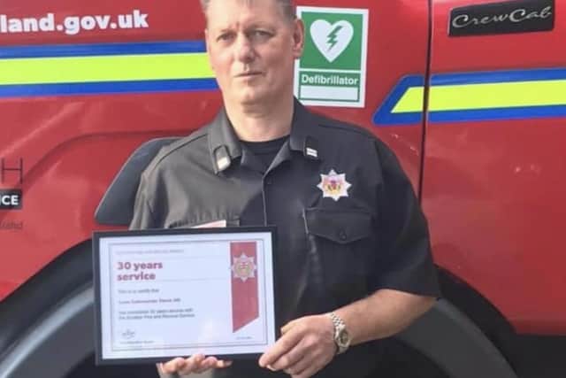 Disgraced and behind bars: Derek Hill with his 30 year service certificate