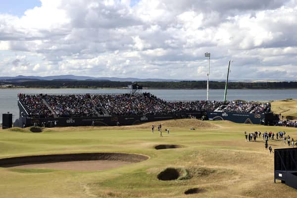 USA's Collin Morikawa, Northern Ireland's Rory McIlroy and USA's Xander Schauffele on the 7th green during day two of The Open at the Old Course, St Andrews.