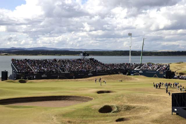 USA's Collin Morikawa, Northern Ireland's Rory McIlroy and USA's Xander Schauffele on the 7th green during day two of The Open at the Old Course, St Andrews.