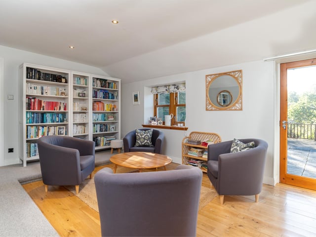 Interior: Its ground floor provides a wealth of flexibility for homebuyers, with spaces currently used as a cinema, reading room, lounge and an open-plan kitchen-diner. The first-floor features an impressive principal bedroom with full-height ceiling.
