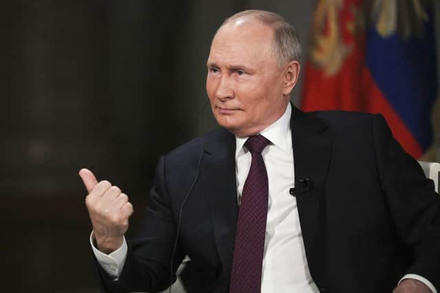 Russian president Vladimir Putin gestures as he speaks during an interview with former Fox News host Tucker Carlson at the Kremlin in Moscow. Picture: Gavriil Grigorov, Sputnik, Kremlin Pool Photo via AP