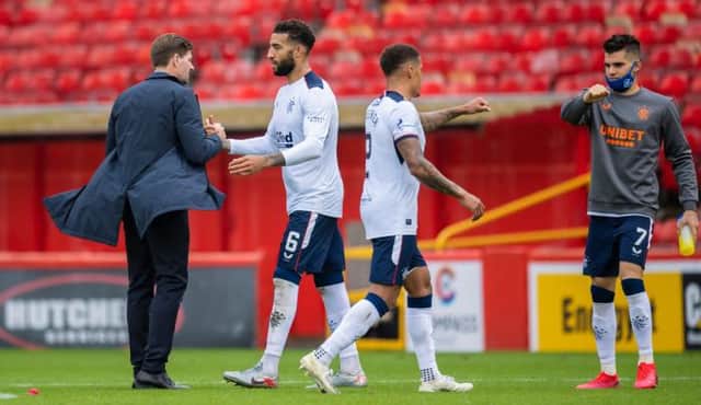 Rangers manager Steven Gerrard congratulates defender Connor Goldson at the end of the 1-0 win against Aberdeen at Pittodrie on the opening day of the season. (Photo by Craig Williamson / SNS Group)