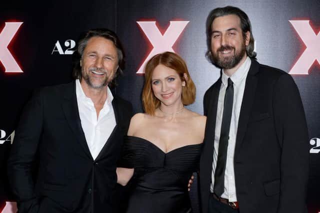Martin Henderson, Brittany Snow, and Ti West attend a photo call for the Los Angeles premiere of A24's "X" at TCL Chinese 6 Theatres on March 15, 2022 in Los Angeles, California. (Photo by Frazer Harrison/Getty Images)