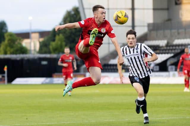St Mirren's 19-year-old wing-back Jay Henderson brings the ball under control during the Premier Sports Cup match against Dunfermline in Paisley. (Photo by Alan Harvey / SNS Group)