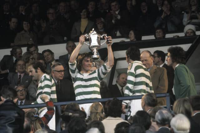 Kenny Dalglish lifts the Scottish Cup with Celtic in 1975.