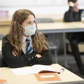 A student at St Columba's High School, Gourock, wears a protective face mask as the requirement for secondary school pupils to wear face coverings when moving around school comes into effect from today across Scotland