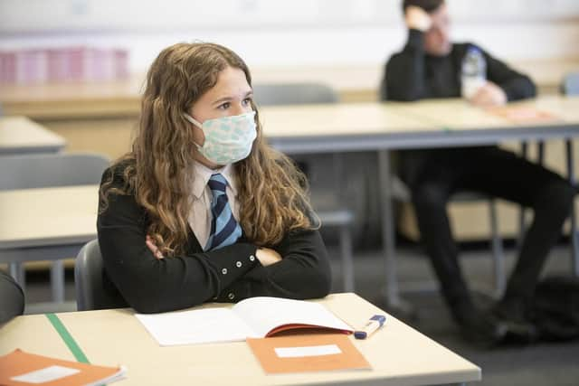 A student at St Columba's High School, Gourock, wears a protective face mask as the requirement for secondary school pupils to wear face coverings when moving around school comes into effect from today across Scotland