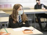 A student at St Columba's High School, Gourock, wears a protective face mask as the requirement for secondary school pupils to wear face coverings when moving around school comes into effect from today across Scotland