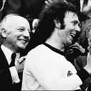 Franz Beckenbauer receives the World Cup after victory over Holland in the 1974 final at Munich's Olympic stadium. (Photo by STF/AFP via Getty Images)