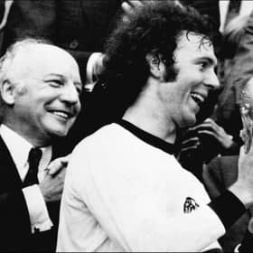 Franz Beckenbauer receives the World Cup after victory over Holland in the 1974 final at Munich's Olympic stadium. (Photo by STF/AFP via Getty Images)