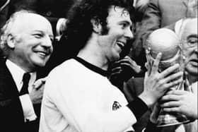 Franz Beckenbauer receives the World Cup after victory over Holland in the 1974 final at Munich's Olympic stadium. (Photo by STF/AFP via Getty Images)