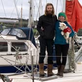 Edd and Charly with their dog, Penny, on board their live-in yacht at Tobermory. Picture: RNLI