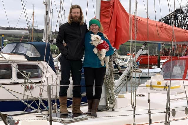 Edd and Charly with their dog, Penny, on board their live-in yacht at Tobermory. Picture: RNLI