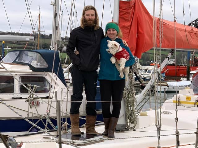 Edd and Charly with their dog, Penny, on board their live-in yacht at Tobermory. Picture: RNLI