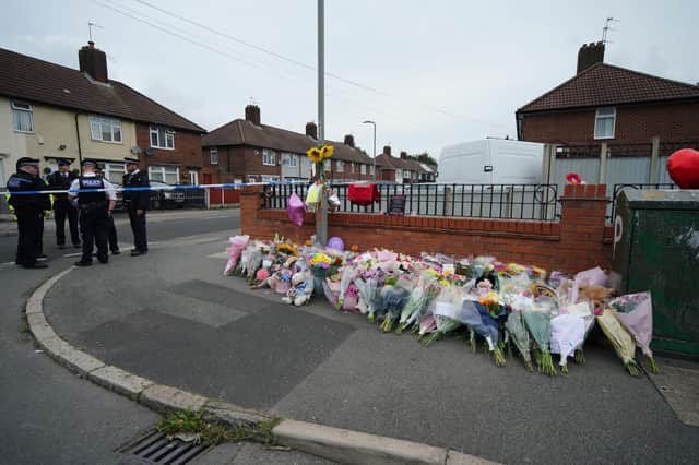 Flowers are left near to the scene of an incident in Kingsheath Avenue, Knotty Ash, Liverpool, where nine-year-old Olivia Pratt-Korbel was fatally shot on Monday night. Picture date: Thursday August 25, 2022.