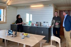 Mairi Gougeon MSP, the Scottish Government's Cabinet Secretary for Rural Affairs & Islands, Peter Smith of Roderick James Architects and Stuart Goodall in the Zero Carbon House.