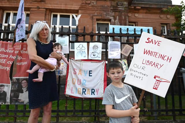 Campaigners have fought to get Whiteinch Library open for the past nine months. Tomorrow (Monday), it will finally open its doors. Pictured are supporters Maureen Cannell (59) with grand children, Mallory (5 months) and Mathew Gallacher, during the summer. PIC: John Devlin.