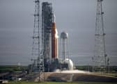 NASA's Space Launch System (SLS) rocket with the Orion spacecraft aboard is seen atop the mobile launcher at Launch Pad 39B