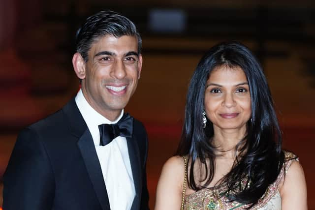 Rishi Sunak alongside his wife Akshata Murthy, who have entered The Sunday Times Rich List for the first time with their joint £730 million fortune, as the Chancellor holds out on fresh support to alleviate the cost-of-living crisis for millions of Britons. (PA)