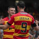 Partick's Aidan Fitzpatrick celebrates his opener with Brian Graham, who went on to score Thistle's second in the 2-0 win over Ross County. (Photo by Craig Foy / SNS Group)