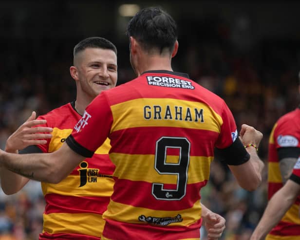 Partick's Aidan Fitzpatrick celebrates his opener with Brian Graham, who went on to score Thistle's second in the 2-0 win over Ross County. (Photo by Craig Foy / SNS Group)