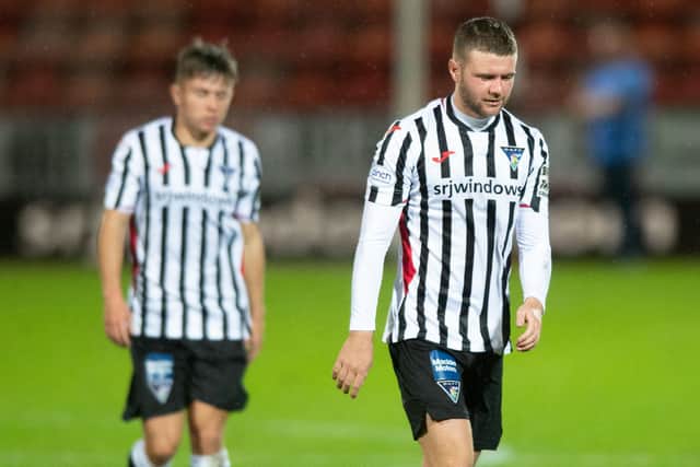 Dom Thomas, right, was replaced in the second half, much to the Dunfermline fans' consternation.