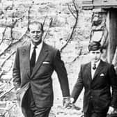 Prince Charles, with his father the Duke of Edinburgh (left) and Captain Iain Tennant, Chairman of the Gordonstoun Board of Governors, arriving at Gordonstoun for the Prince's first day at the school