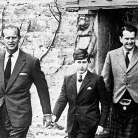 Prince Charles, with his father the Duke of Edinburgh (left) and Captain Iain Tennant, Chairman of the Gordonstoun Board of Governors, arriving at Gordonstoun for the Prince's first day at the school