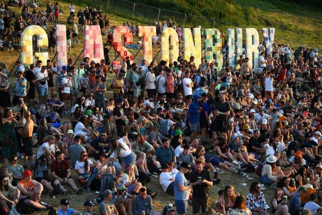 Festivalgoers attend the Glastonbury festival near the village of Pilton in Somerset, southwest England, on June 22, 2022.