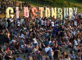 Festivalgoers attend the Glastonbury festival near the village of Pilton in Somerset, southwest England, on June 22, 2022.