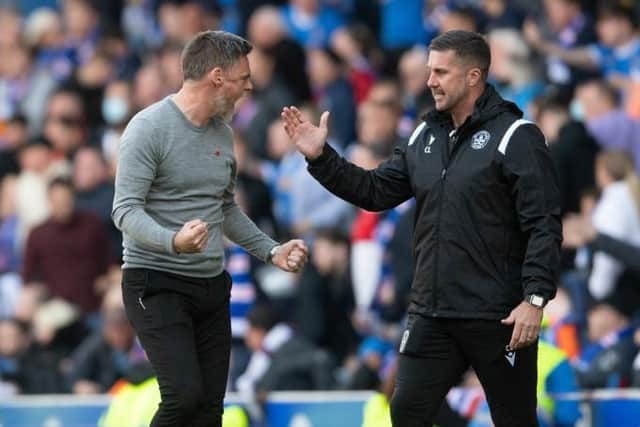 Motherwell manager Graham Alexander (left) celebrates at full-time at Ibrox with his assistant Chris Lucketti (right). (Photo by Craig Foy / SNS Group)