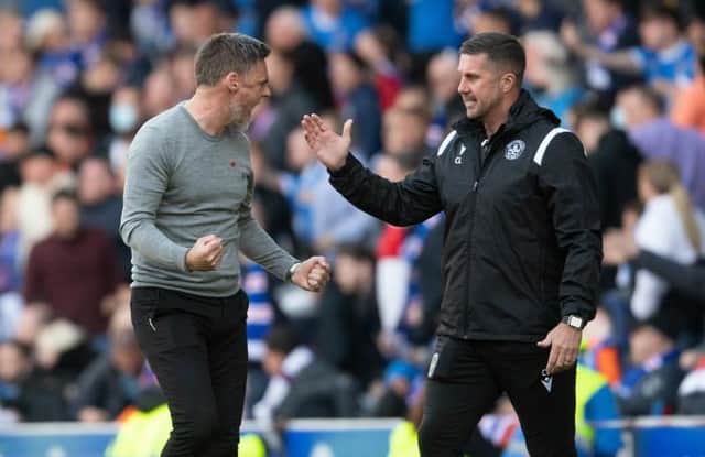 Motherwell manager Graham Alexander (left) celebrates at full-time at Ibrox with his assistant Chris Lucketti (right). (Photo by Craig Foy / SNS Group)