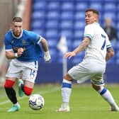 Ryan Kent of Rangers looks to get past Tranmere Rovers' goalscorer Kieron Morris during the pre-seaon meeting between the two sides at Prenton Park