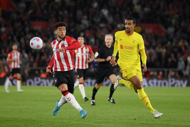 Che Adams (left) in action for Southampton against Joel Matip of Liverpool on May 17. (Photo by Mike Hewitt/Getty Images)
