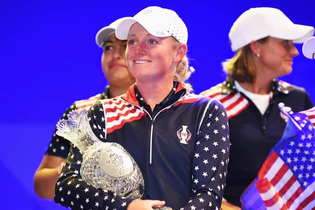 Stacy Lewis cradles the Solheim Cup after helping Team USA win the 2015 match at St Leon-Rot Golf Club in Germany. Picture: Stuart Franklin/Getty Images.