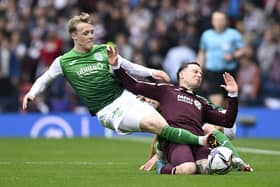Hibs Jake Doyle-Hayes challenges Hearts' Barrie McKay during the match at Hampden.