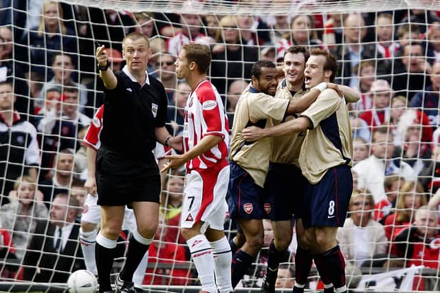 Referee Graham Poll indicates he has awarded the goal despite having impeded Sheffield United midfielder Michael Tonge in the lead-up to Freddie Ljungberg's winning strike for Arsenal in the 2003 FA Cup semi-final (Photo by Gary M. Prior/Getty Images)
