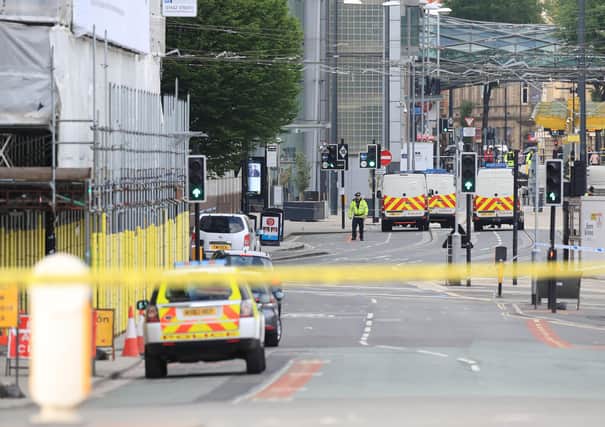 The scene close to the Manchester Arena the morning after the terror attack at an Ariana Grande concert. Picture: Peter Byrne/PA Wire.