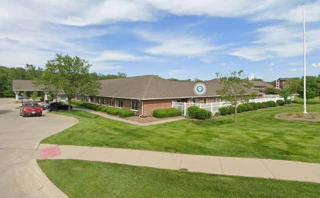 A US care home has been fined 10,000 dollars after a funeral home discovered a woman sent to it in a body bag was still alive.