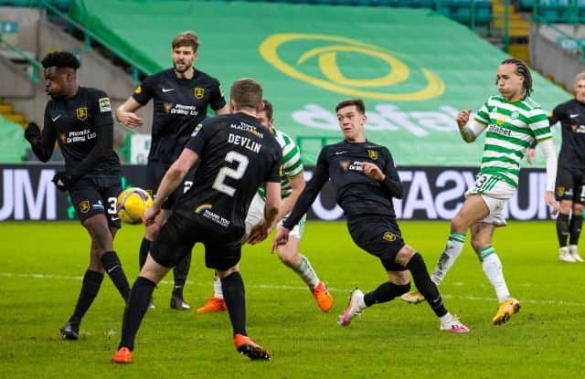 Celtic's Diego Laxalt (R) has a second half shot blocked during a Scottish Premiership match between Celtic and Livingston at Celtic Park on January 16, 2021, in Glasgow, Scotland. (Photo by Alan Harvey / SNS Group)