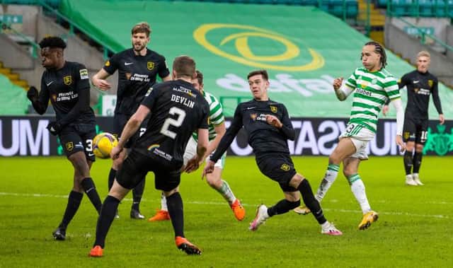 Celtic's Diego Laxalt (R) has a second half shot blocked during a Scottish Premiership match between Celtic and Livingston at Celtic Park on January 16, 2021, in Glasgow, Scotland. (Photo by Alan Harvey / SNS Group)