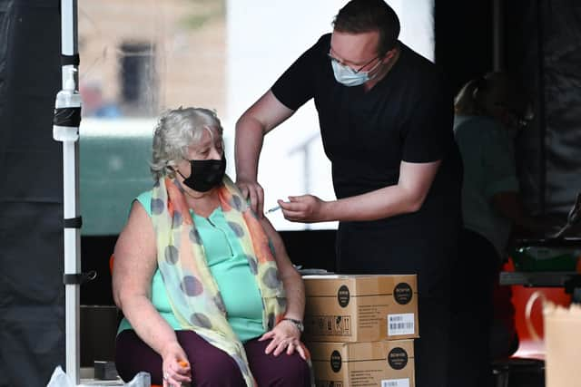 Queues outside the vaccination centre in Govan at Govan Housing Association car park (Photo: John Devlin).