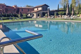 The gorgeous swimming pool area of Villa La Massa. Pic: Getty Images