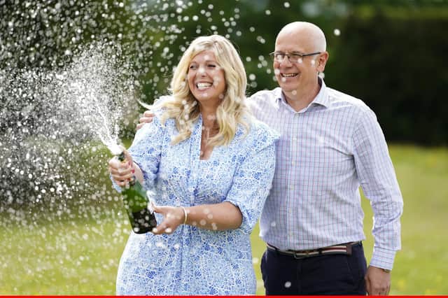 Joe Thwaite, 49, and Jess Thwaite, 46, from Gloucestershire celebrate after winning the record-breaking EuroMillions jackpot of £184m