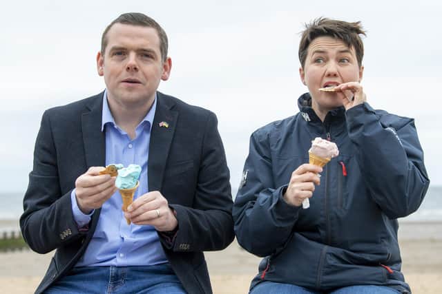Scottish Conservative leader Douglas Ross (left) and former Scottish Conservative Leader Ruth Davidson stop to have an ice cream at Oscars during a visit to Portobello, Edinburgh, on the local election campaign trail.