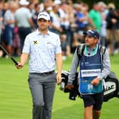 Bernd Wiesberger and caddie Jamie Lane walk down the 18th hole during the final round of the BMW PGA Championship at Wentworth. Picture: Andrew Redington/Getty Images.