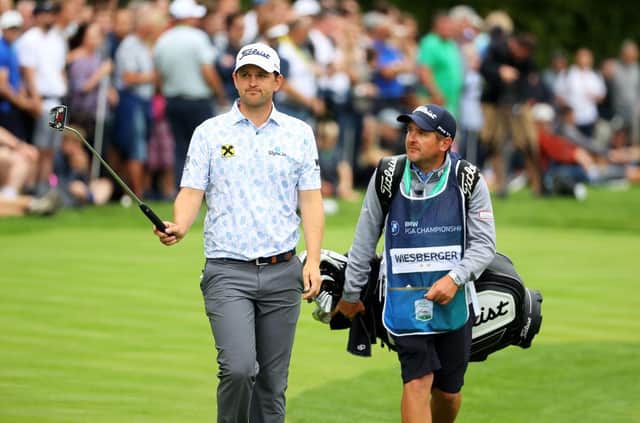 Bernd Wiesberger and caddie Jamie Lane walk down the 18th hole during the final round of the BMW PGA Championship at Wentworth. Picture: Andrew Redington/Getty Images.